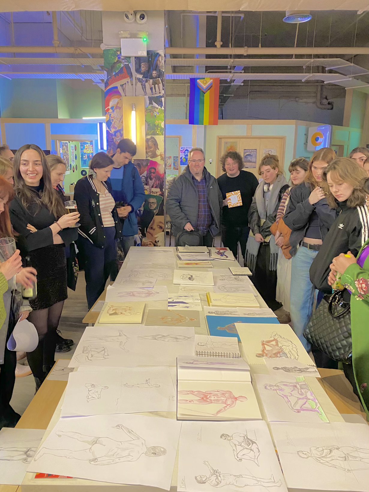 Artists gathered around a table at a City Life Drawing session